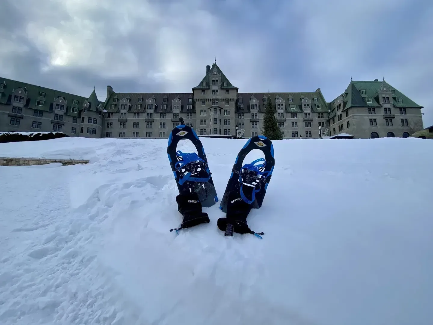 Snow-covered grounds in front of the stone château at Fairmont Le Manoir Richelieu, La Malbaie